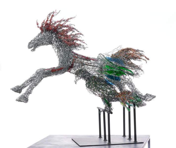 Flying Into the Wind, 2020.
Metal, glass, and copper-core wire: amber, amethyst, antique bronze, black, blue, brown, copper, green, magenta, and peridot.
37 x 30 x 19 in. : Horses : Joan Danziger